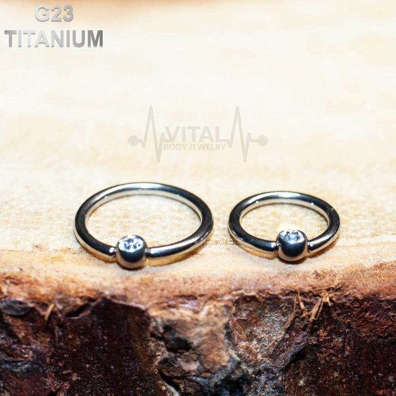 16G titanium nose ring with a 3mm gem ball end, featuring a captive bead design for comfortable wear and a durable PVD coated finish.