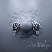 14G surgical steel nipple rings with skeleton hand design for unique body jewelry style and comfort