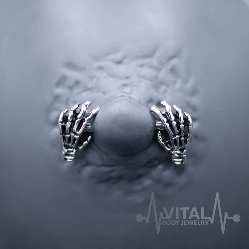 14G surgical steel nipple rings with skeleton hand design for unique body jewelry style and comfort
