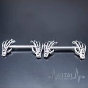 14G surgical steel nipple rings with skeleton hand design for unique body art, made for comfort and durability.