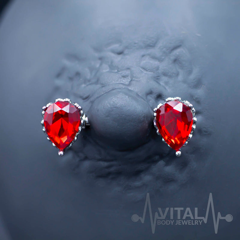 14G surgical steel nipple barbell with double front facing red aurora borealis CZ gems for an eye-catching sparkle.