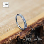20G 14K gold bendable nose hoop ring with 10 CZ gems for a secure, lightweight fit and customizable design