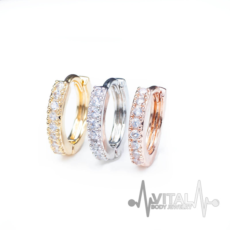 18G surgical steel hinged hoop earrings with cubic zirconia stones for versatile wear on nose, ears, or cartilage.