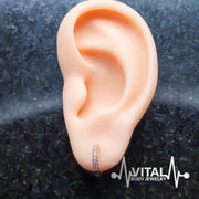 18G surgical steel hinged hoop earrings with cubic zirconia stones for versatile wear on nostrils, ears, and cartilage.