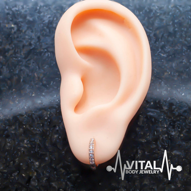 18G surgical steel hinged hoop earrings with cubic zirconia stones for versatile wear on nostrils, ears, and cartilage.