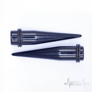 12G black acrylic ear stretchers with lightweight design, featuring rubber o-rings for secure fit and smooth finish for comfort.