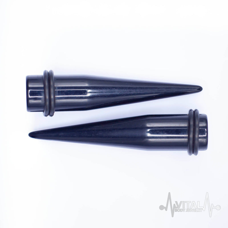 12G black acrylic ear stretchers with lightweight design, featuring rubber o-rings for secure fit and smooth finish for comfort.