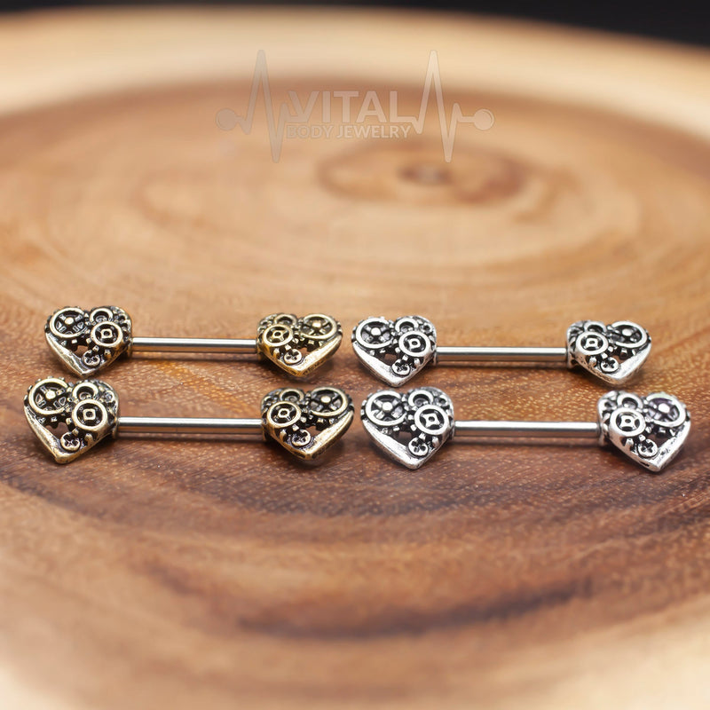 14G surgical steel nipple barbell with steampunk heart design in antique gold and silver finishes for unique style and comfort