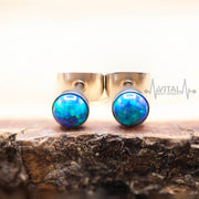 20G titanium opal stud earrings with 4mm white, aqua, and purple opal stones, designed for sensitive ears and comfortable all-day wear