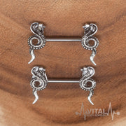14G surgical steel nipple rings with intricate cobra design for a bold body jewelry statement.