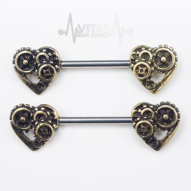14G surgical steel nipple barbell with steampunk heart design and antique gold and silver finishes for a vintage touch