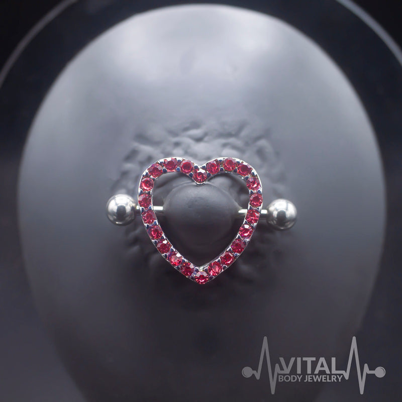 14G surgical steel nipple shields with heart design and cubic zirconia gems for a stylish and comfortable fit