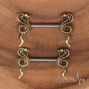 14G surgical steel nipple rings with cobra design for a bold statement, featuring a smooth finish and lightweight feel for comfort.