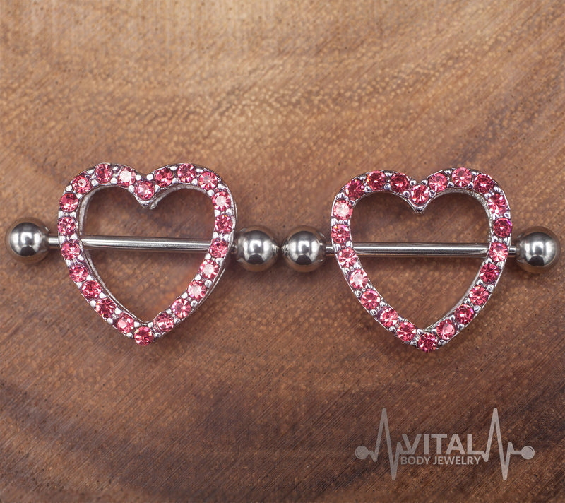 14G surgical steel nipple shields with heart design and cubic zirconia gems for a stylish and comfortable fit