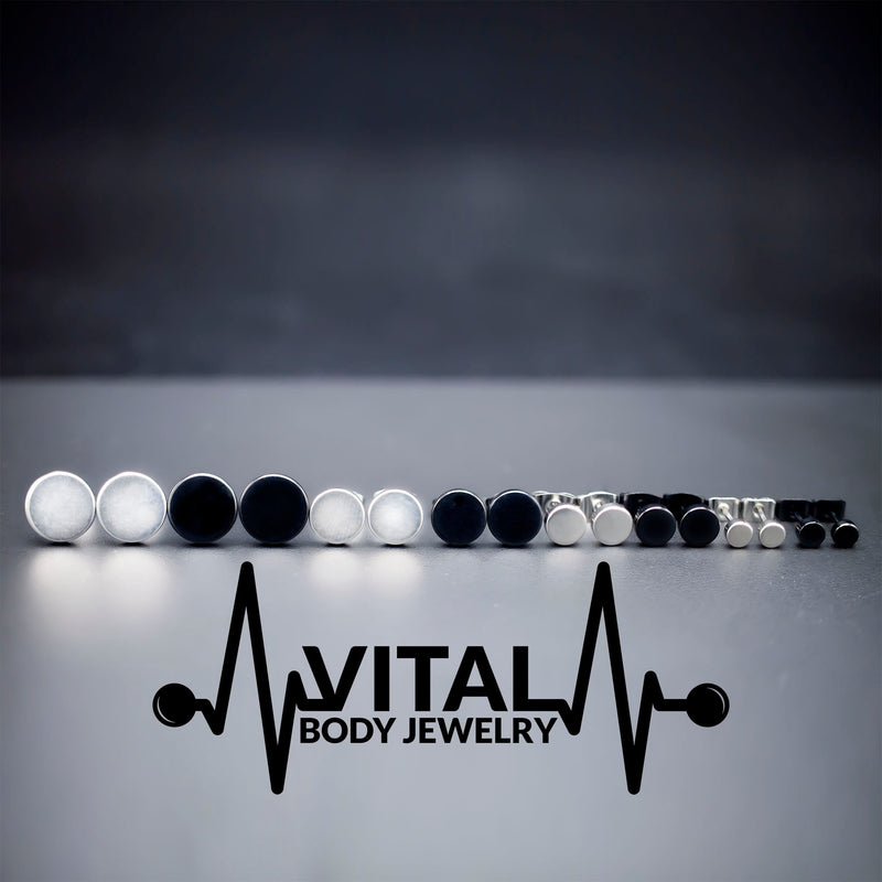 16G PVD coated surgical steel fake plugs with a sleek black finish, designed to mimic larger gauge styles for a trendy look.