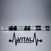 16G PVD coated surgical steel fake plugs with a sleek black finish, designed to resemble larger gauge earrings without the commitment of stretching.