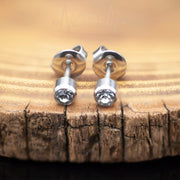 20G surgical steel stud earrings with 4mm cubic zirconia stones, elegant design perfect for everyday wear and all occasions.