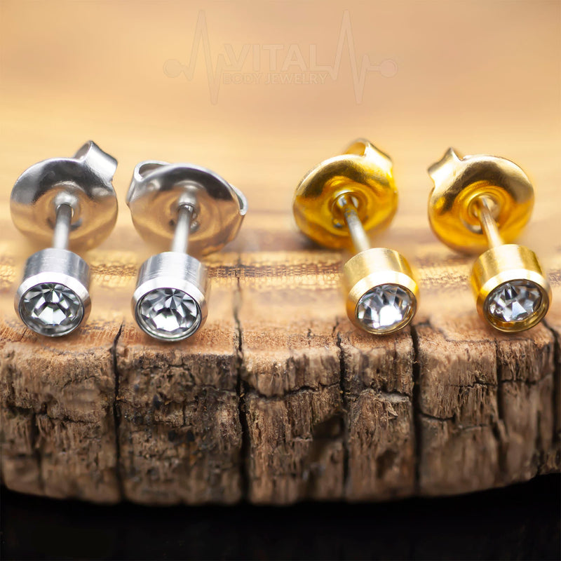 20G surgical steel stud earrings with 4mm cubic zirconia gems for elegant everyday wear. Ideal for sensitive skin and all-day comfort.