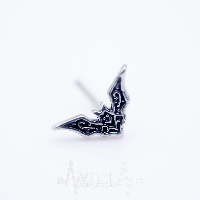 20G surgical steel L-bend nose stud with whimsical bat design, crafted for comfort and secure fit