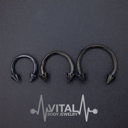 16G surgical steel septum ring with striking spike ends for a bold and stylish look, available in multiple diameters.