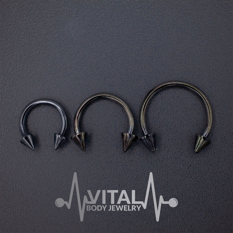 16G surgical steel septum ring with striking spike ends for a bold and stylish look, available in multiple diameters.