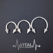 16G surgical steel septum ring with spike ends, featuring a PVD coating for durability and available in multiple diameters.