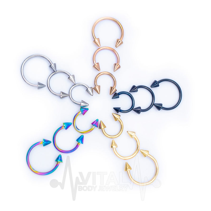 16G surgical steel septum ring with spike ends, PVD coated for a durable finish and lightweight comfort. Available in multiple diameters.