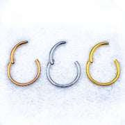 18G surgical steel hinged nose ring with CZ paved stones for a sparkling and comfortable fit, ideal for daily wear and special occasions.