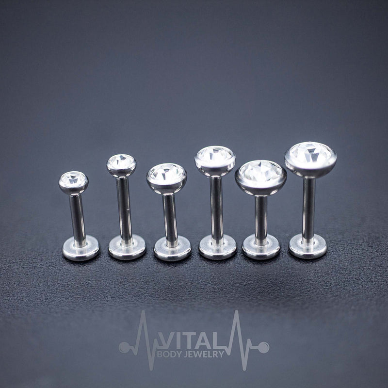 16G surgical steel labret stud with prong set cubic zirconia gem, featuring an internally threaded design for comfort and smooth insertion