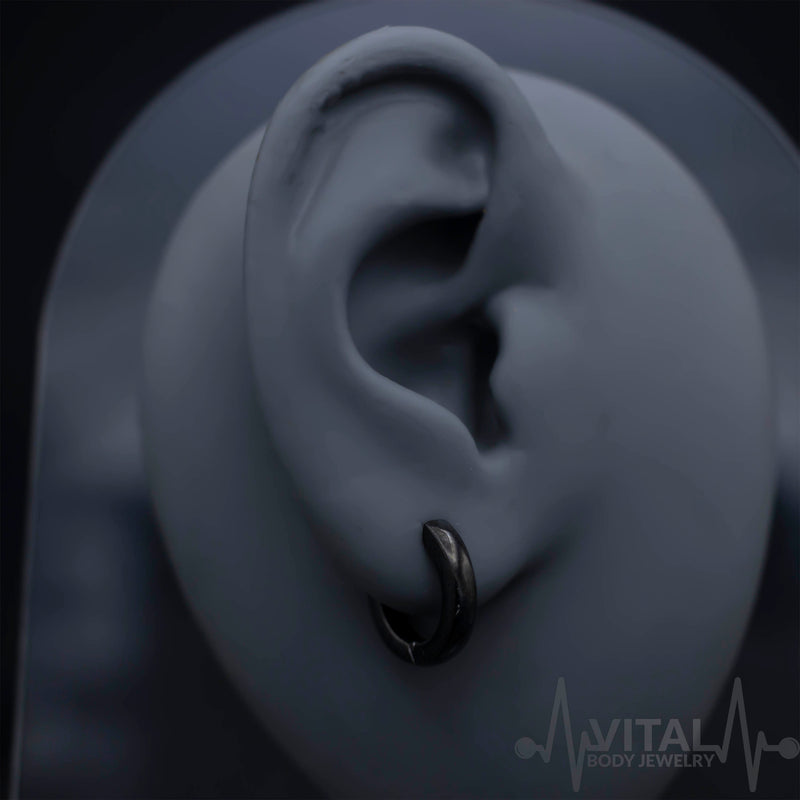 20G surgical steel huggie hoop earrings with dome design in black, silver, gold, and rainbow options for a stylish accessory.