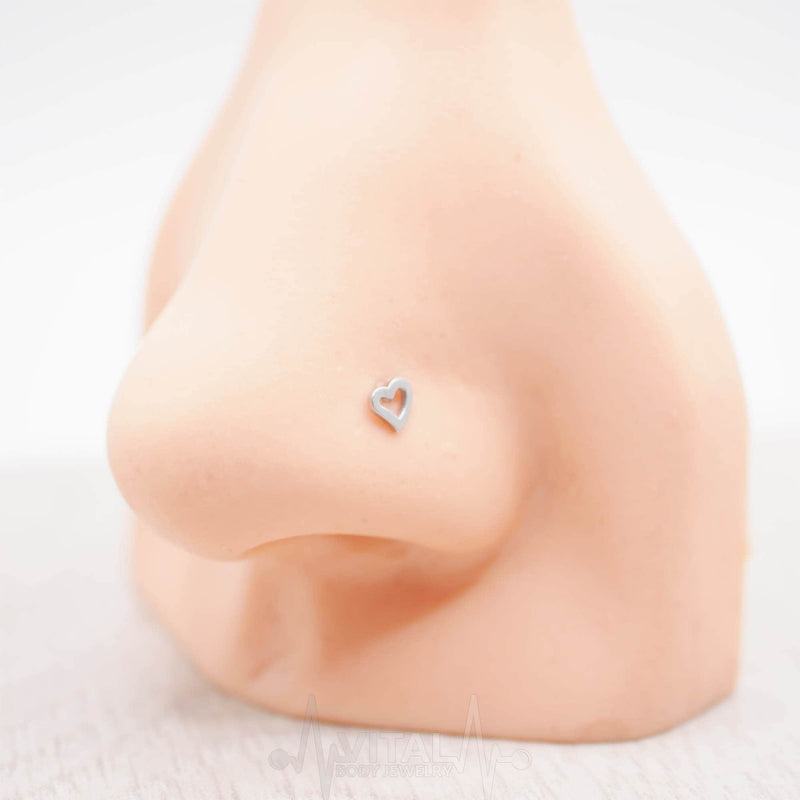 20G surgical steel L-bend nose ring with heart stud, hypoallergenic and designed for secure, comfortable everyday wear.