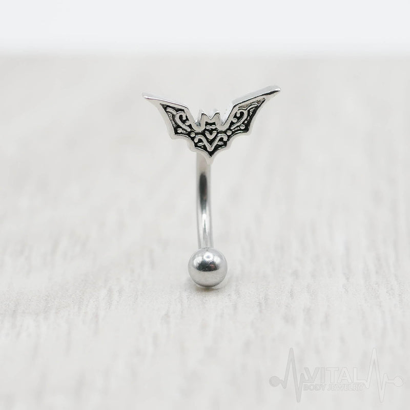 16G surgical steel eyebrow ring with bat design, featuring 10mm bat charm and 3mm ball end for a unique look