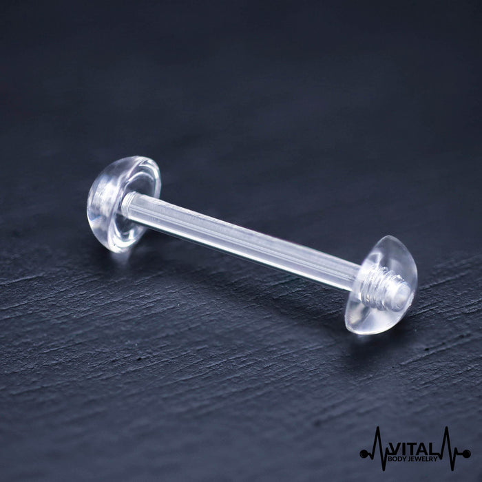 14G Bio Flex tongue barbell with flexible retainer, available in pink, clear, and peach/white, hypoallergenic for sensitive skin.