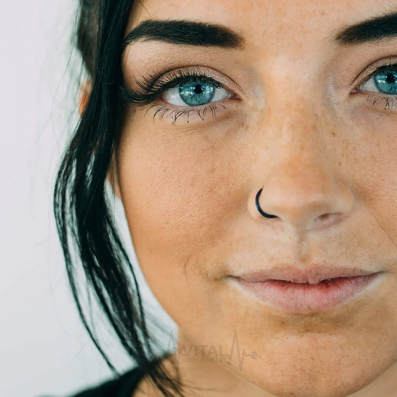 14G titanium hinged segment nose ring with a sleek black finish for comfortable everyday wear and elegant style